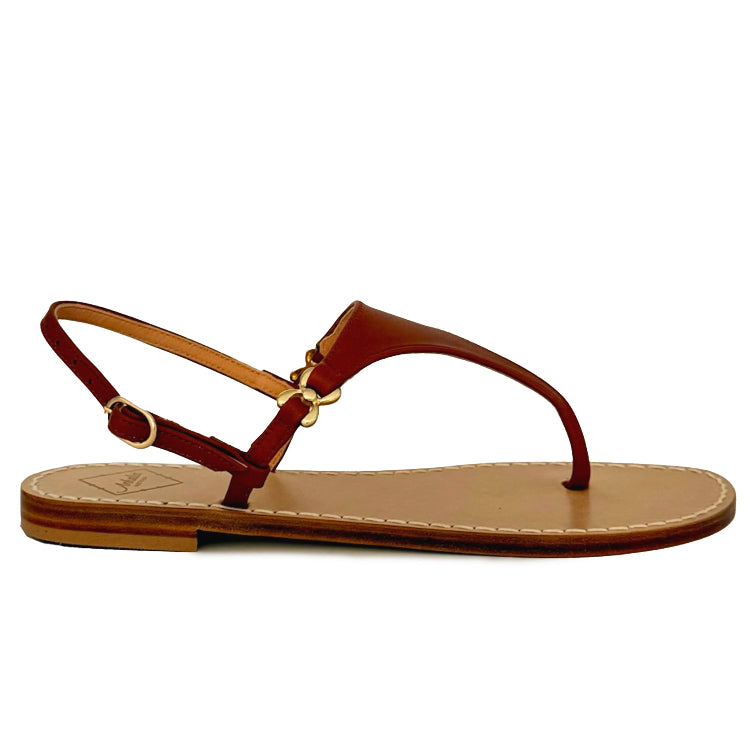 Tan brown sandal with gold embellishments  on a thin strap on a white background with side view