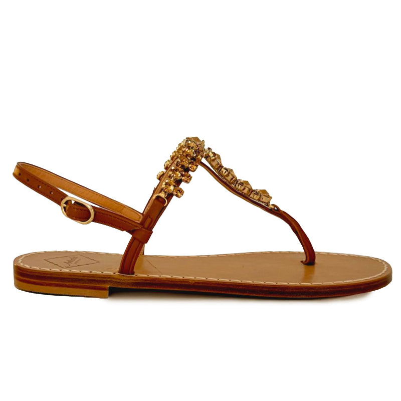 Tan sandal with Swarovski crystal embellished straps on a white background.